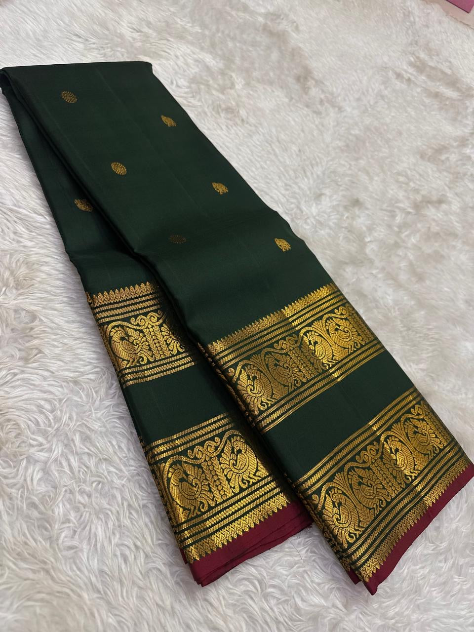 Bottle Green and Arakku Red Handwoven Pure Silk Kanjipuram Saree with Rettapet Yaanai Chakram Butta and Annam Pallu Border