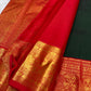 Kanjeevaram pure silk saree in bottle green with detailed ornate vermilion pallu