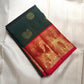 Kanjivaram butta saree in bottle green with Mayil Chakram buttas across the body