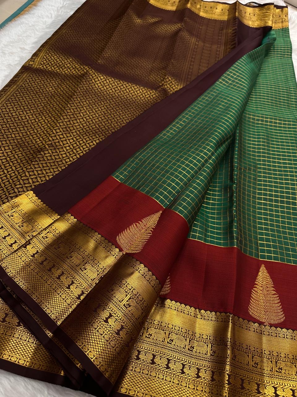 Bottle green Kanchipuram pure silk saree with red Thazhampoo Reku tree motif zari border — Idam Living