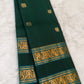 Bottle green handwoven Kanchipuram silk saree showing its traditional Rettapet zari borders.