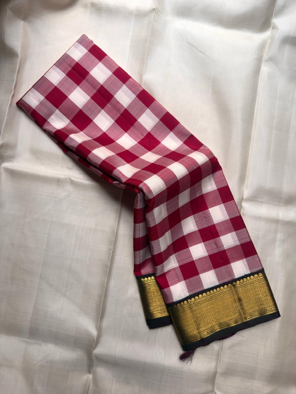 Close-up of the rose pink and white checked Paalum Pazhamum blouse piece.