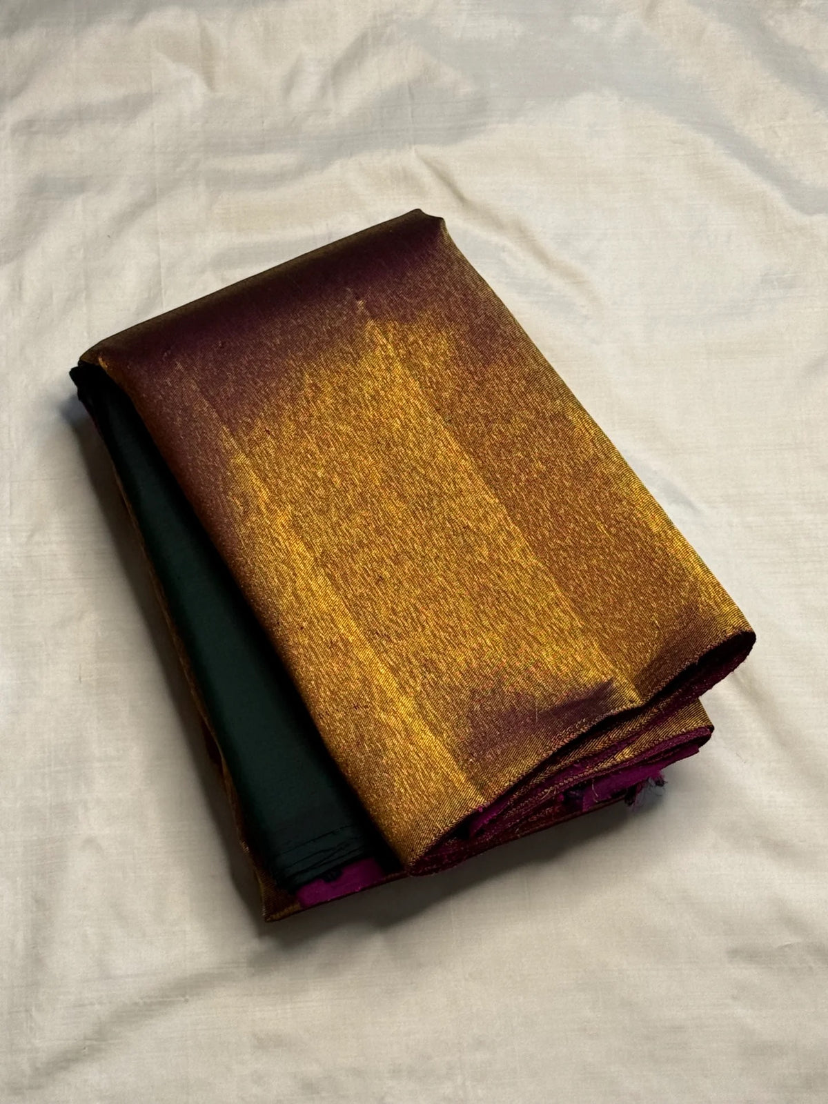 Deep bottle green handwoven pure silk Kanjeevaram saree with copper-gold Ettukol border