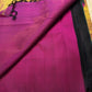 Detail of the copper-gold border and Vadamalli magenta geometry on the bottle green Kanjeevaram saree