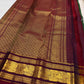 Bottle Green Kanjivaram Zari Kattam saree — maroon elephant medallion border close-up