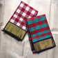 Broad gold zari border with chevron-like weave and dark green edge.