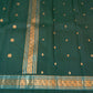 Bottle Green Pure Silk Kanchipuram Saree with antique-gold zari buttas and double-sided Rettapet border.