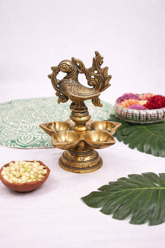 Handcrafted brass five wick pooja lamp with peacock top and 5 inch wide base