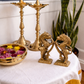 Handcrafted brass Yazhi statue pair facing each other with lotus flower and peacock feather traditional decor styling