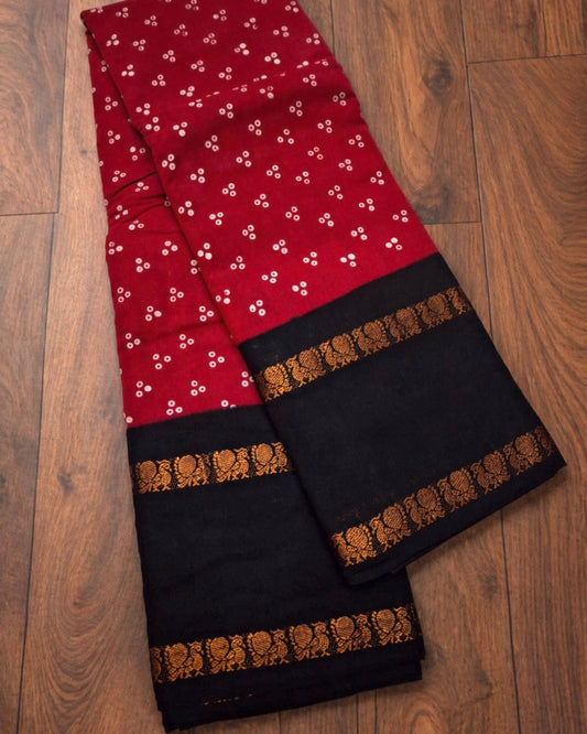 Madurai Sungudi wax resist saree with dotted motifs and contrast rettapet border detail