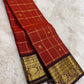 Brick red pure silk saree body close up view