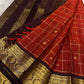 Gold zari kattam grid detail on brick red silk saree