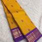 Border detail close up on brick red Kancheepuram saree