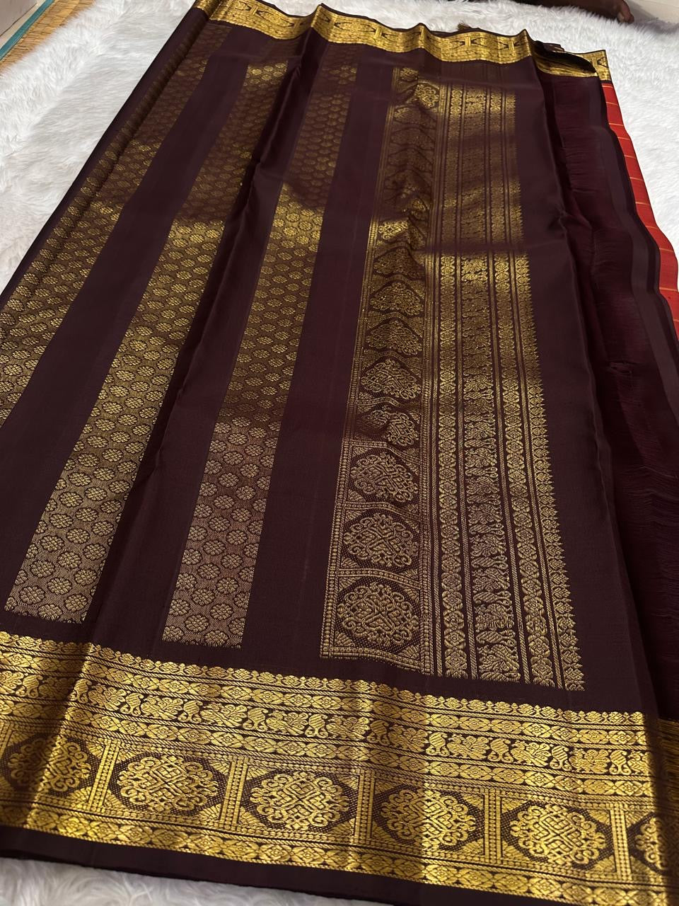 Pallu detail of brick red Kancheepuram silk saree