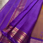Zari detail on brick red Kancheepuram saree grid