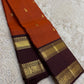 Brick red Rettapet Kanchipuram silk saree body close-up with gold zari buttas