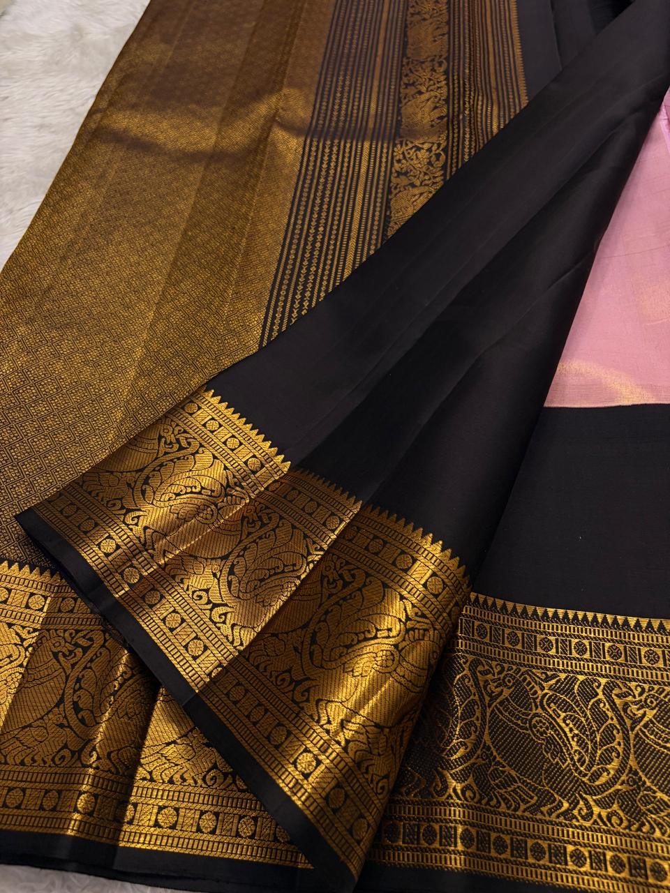 Kanchana purple Kanjivaram silk saree folded view with deep brown korvai border and gold zari detail