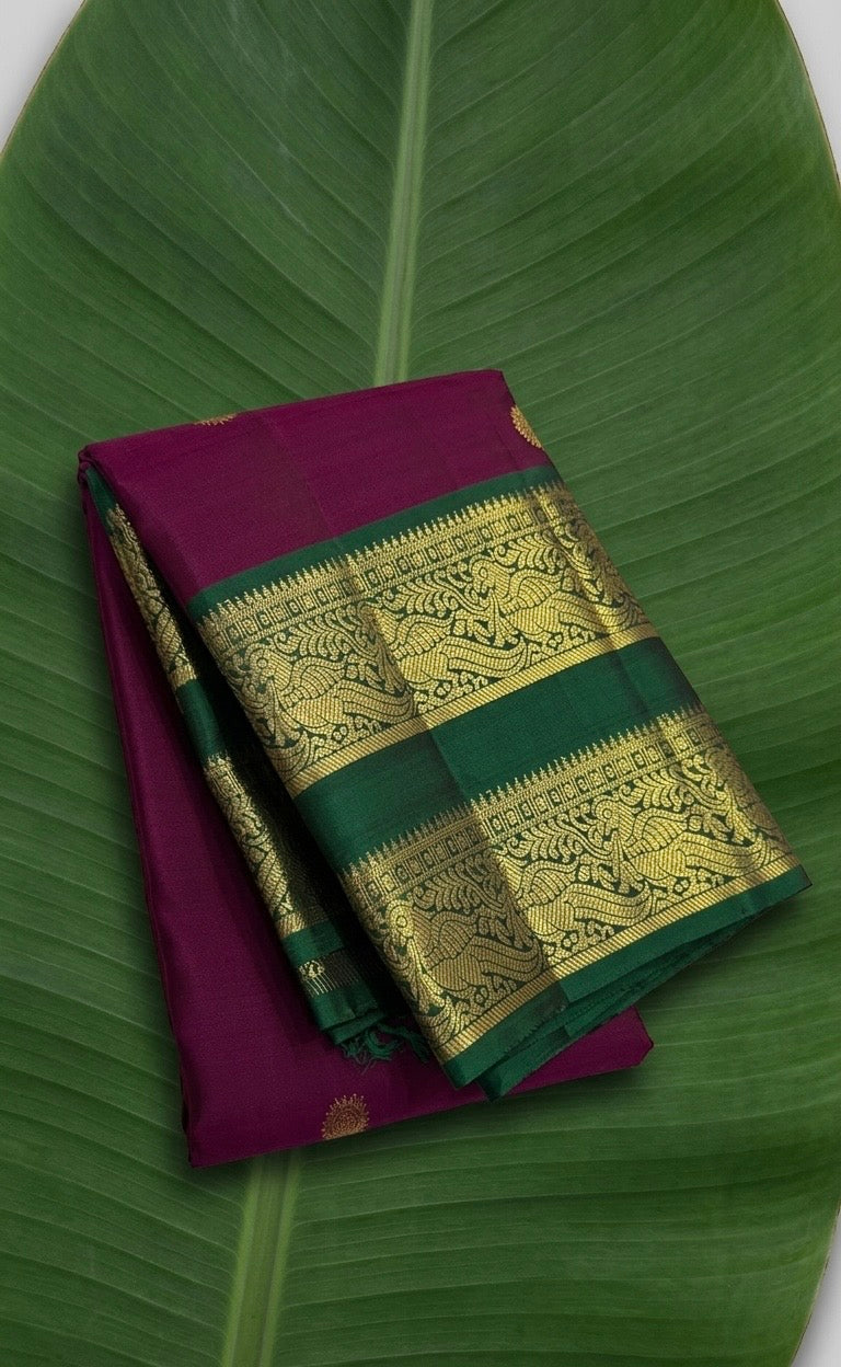 Bright berry pink Kanchipuram silk saree with bottle green rettapet border and gold zari Idam Living
