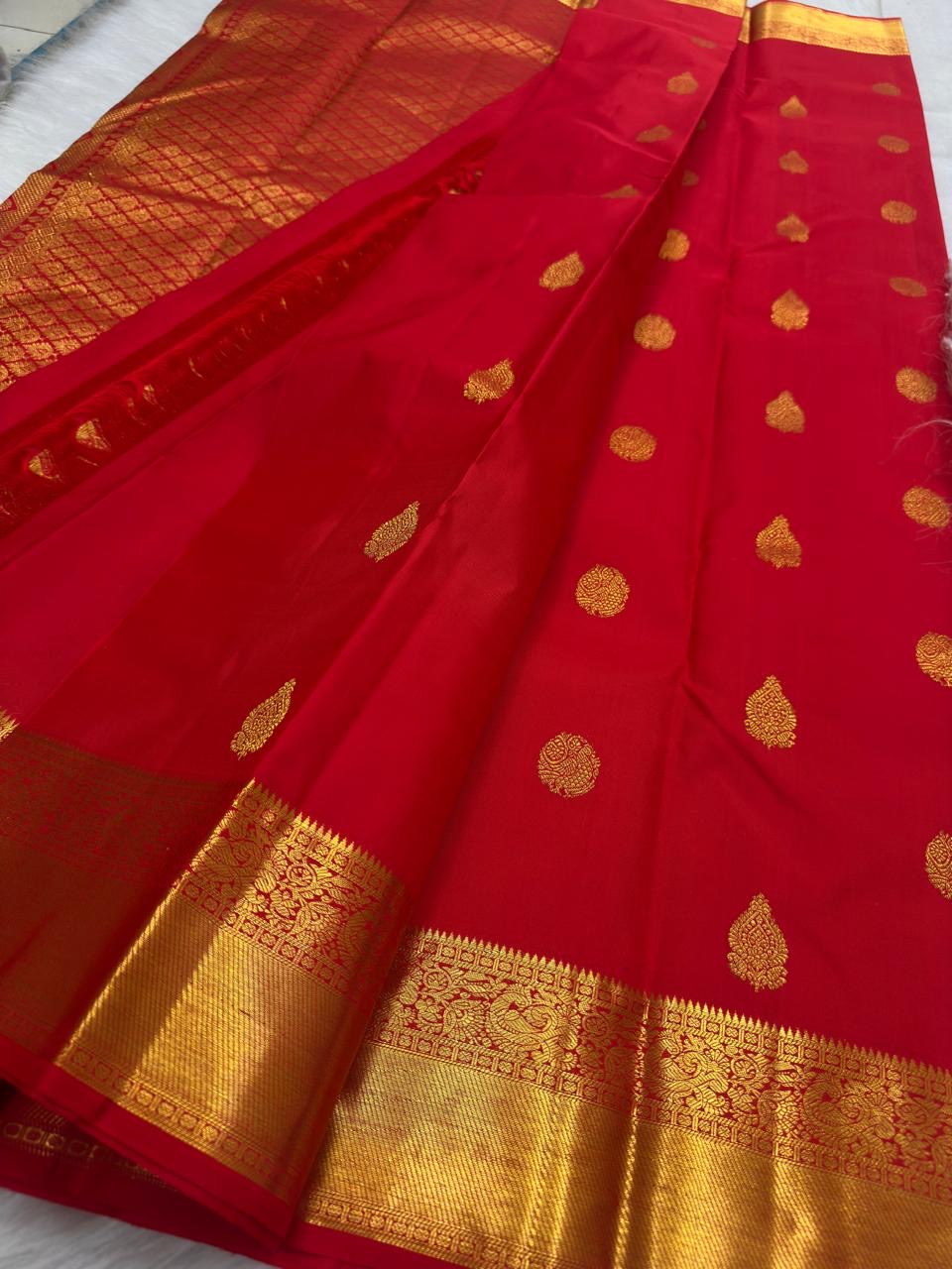 Richly worked zari pallu on bright red Pure Silk Kanjeevaram saree