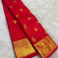 Mayil and floral zari buttas spaced across bright red Kanchipuram silk
