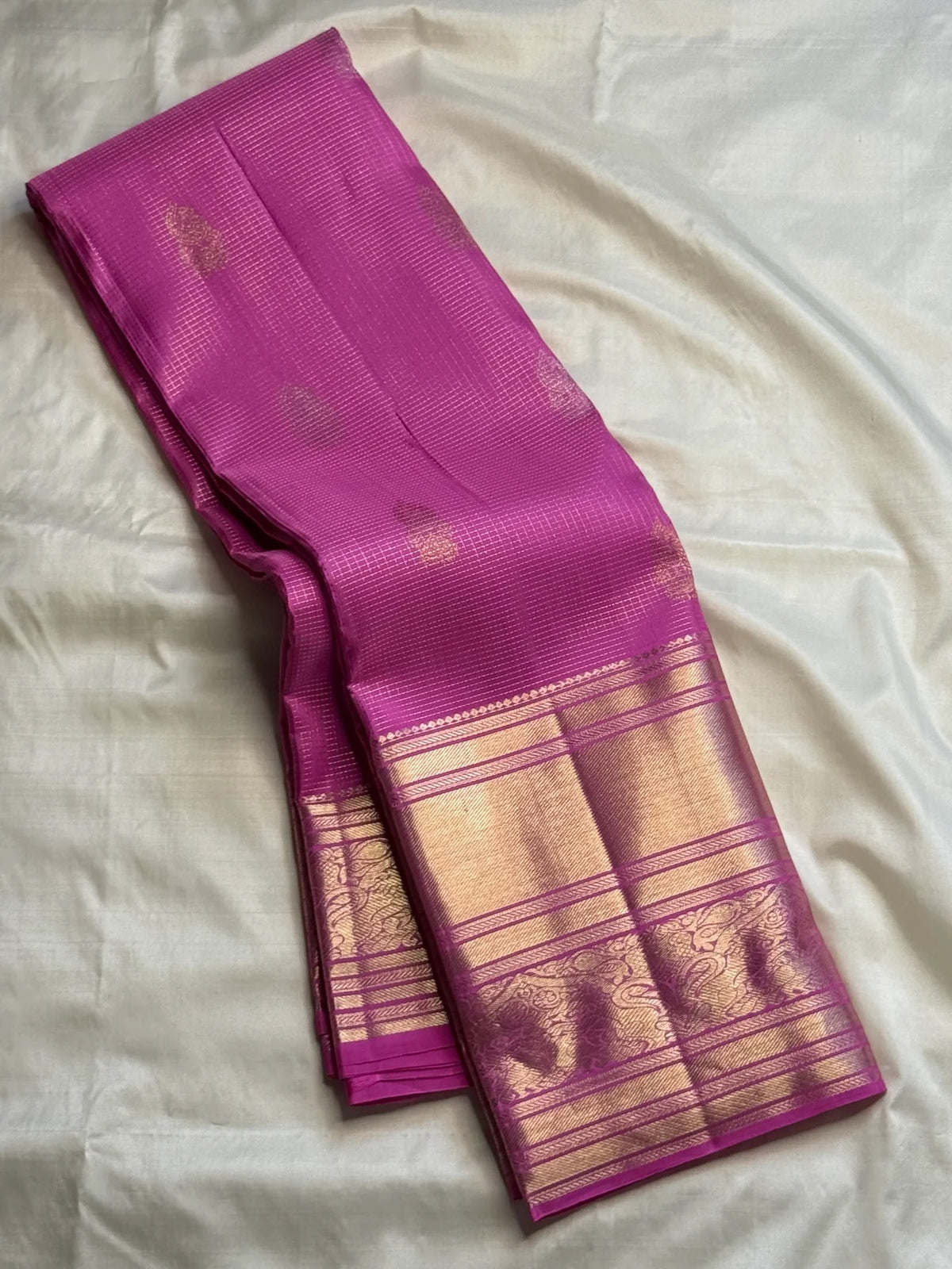Detail of the broad Banarasi-weave zari border on the orchid pink Kanchipuram Vairaoosi saree