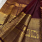 Close view of broad antique-gold elephant border on Deep Maroon Brown Kanjivaram silk.