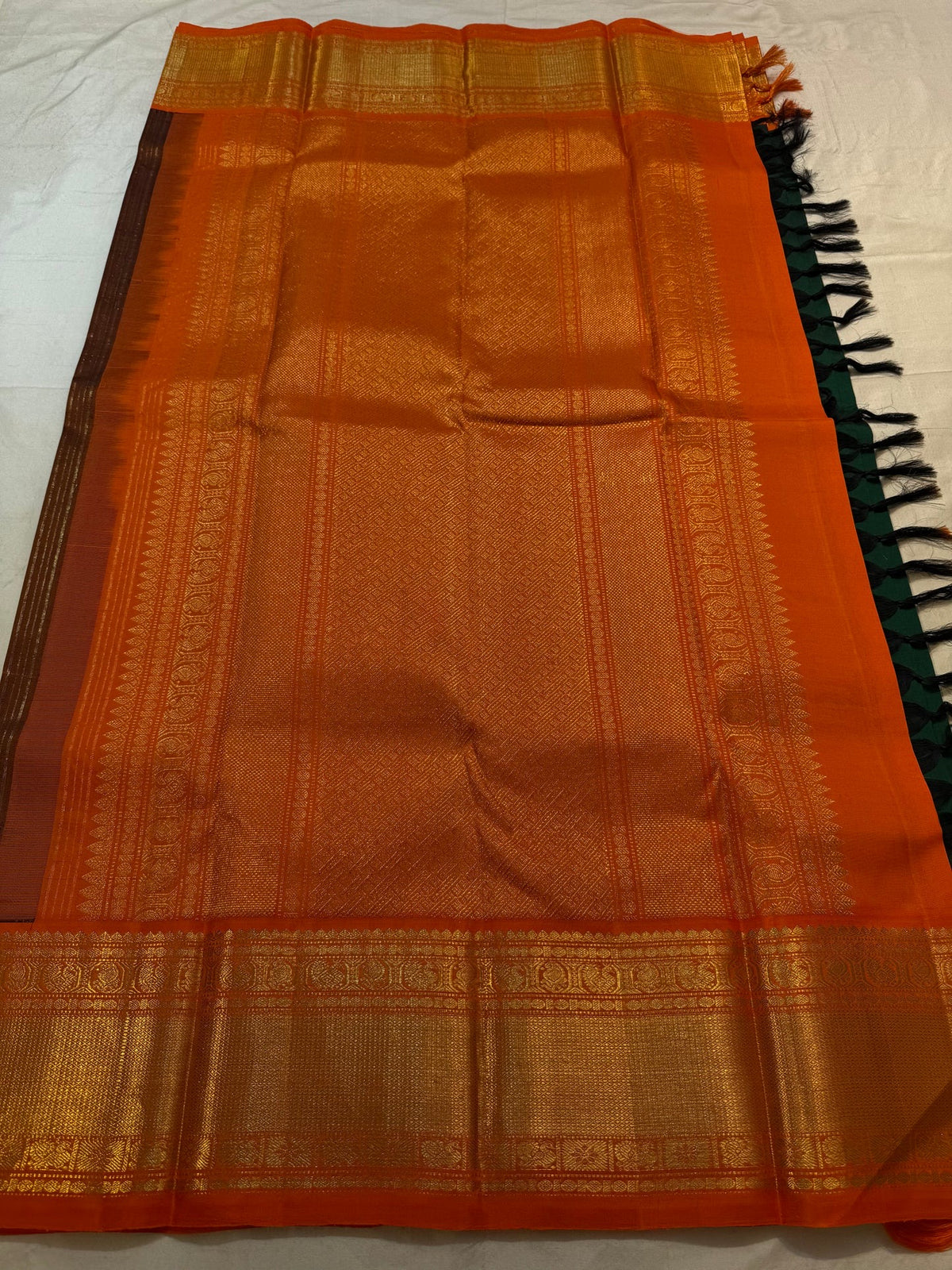 Broad gold zari border detail on Emerald Green Kanjivaram silk