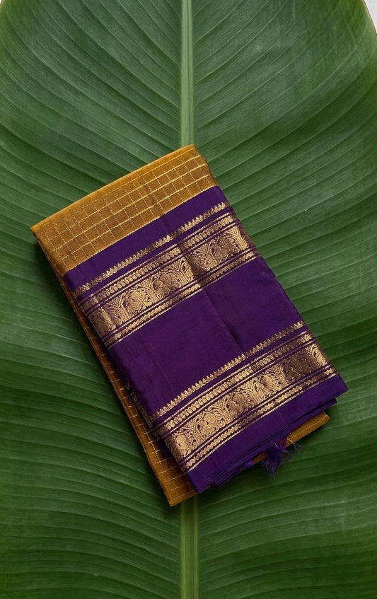 Bronze ponvandu gold Kanchipuram silk saree with jamun purple korvai border folded display