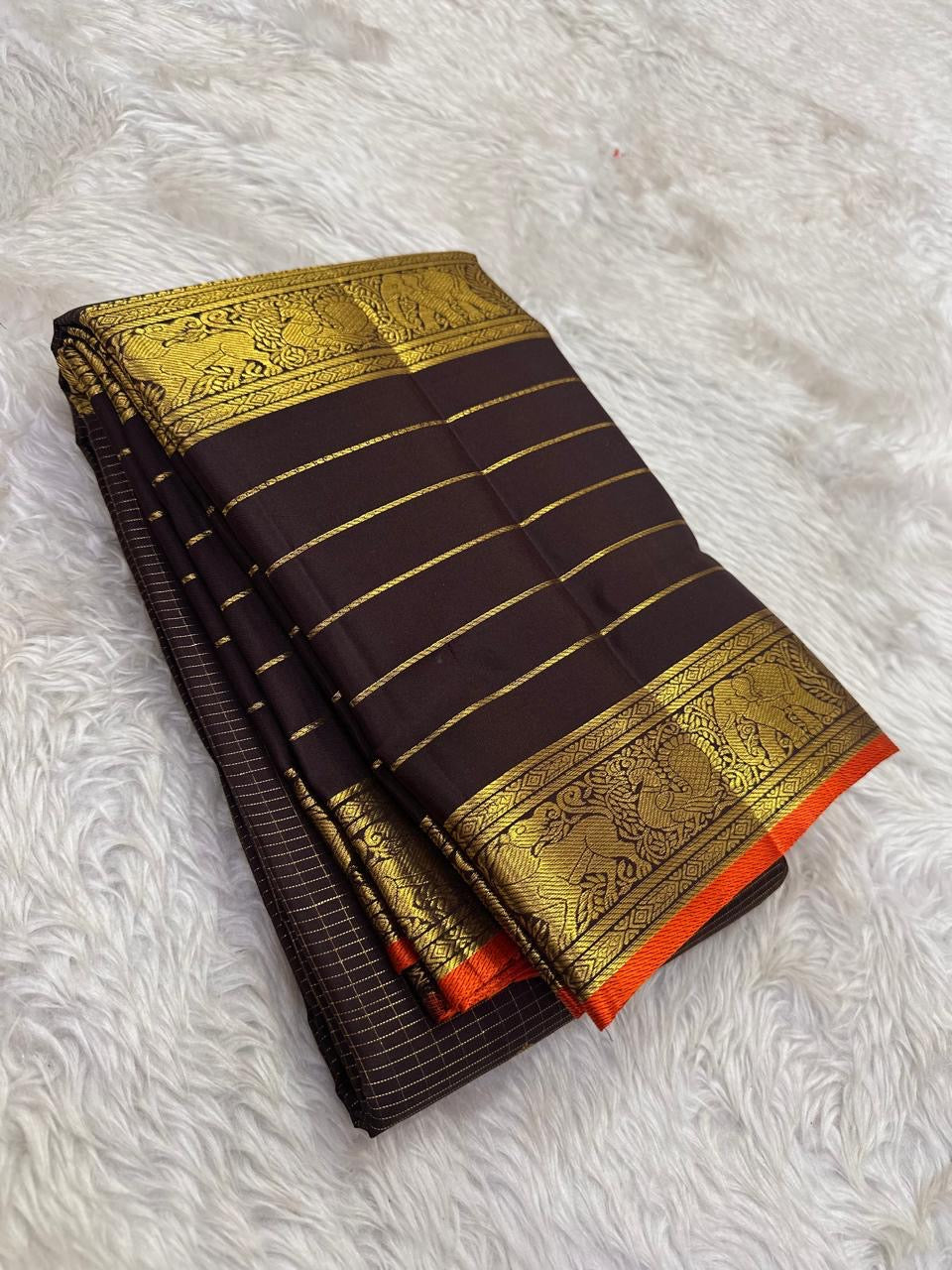 Brown pure mulberry silk Varisaipet saree with fine gold lines and Burnt Orange selvedge.