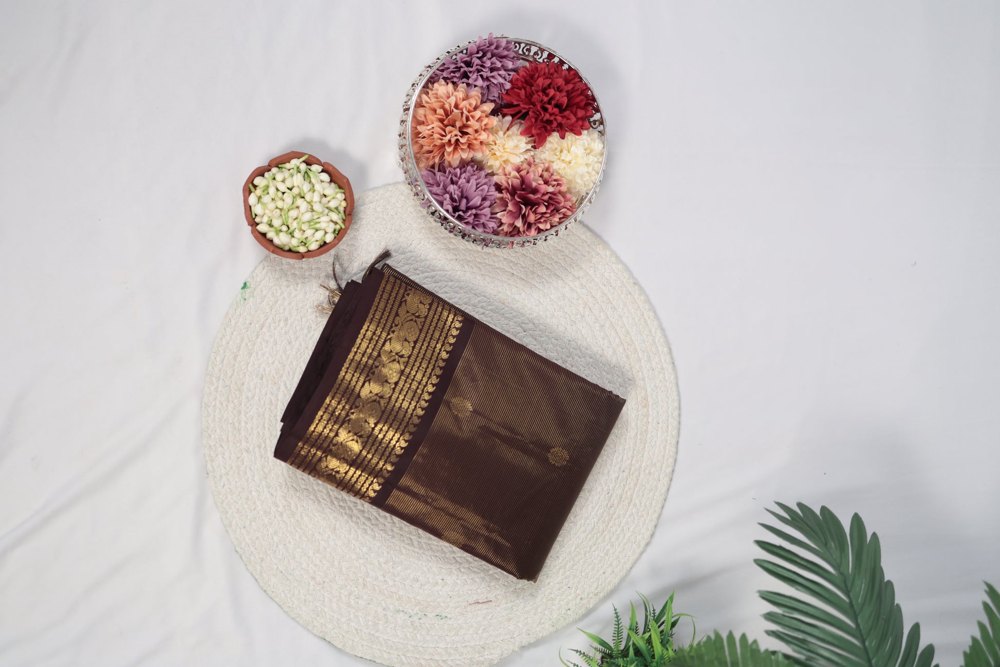 Front display deep brown vairaoosi Kanchipuram silk saree with zari woven border and tassels