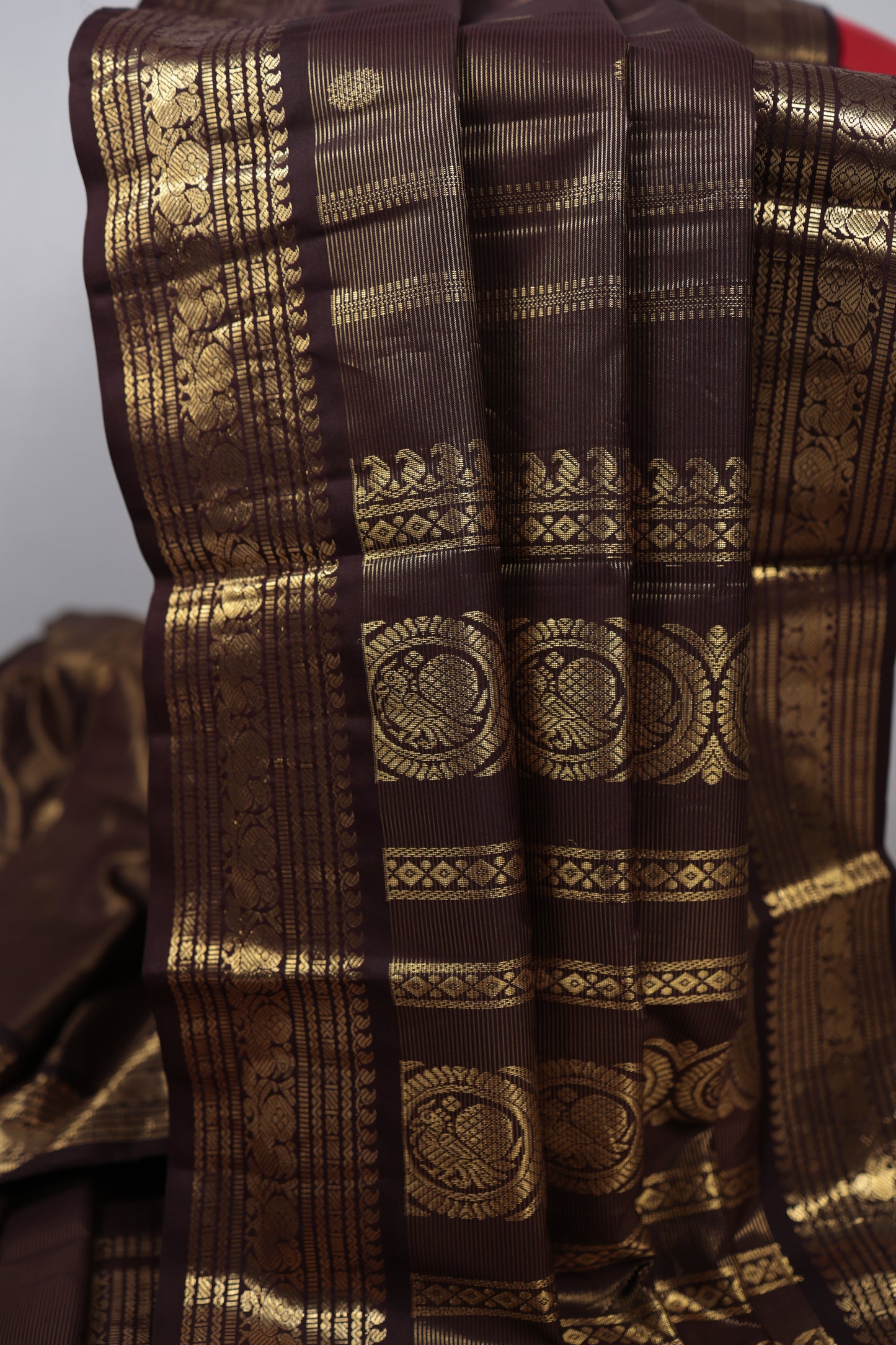 Brown fabric with gold intricate patterns