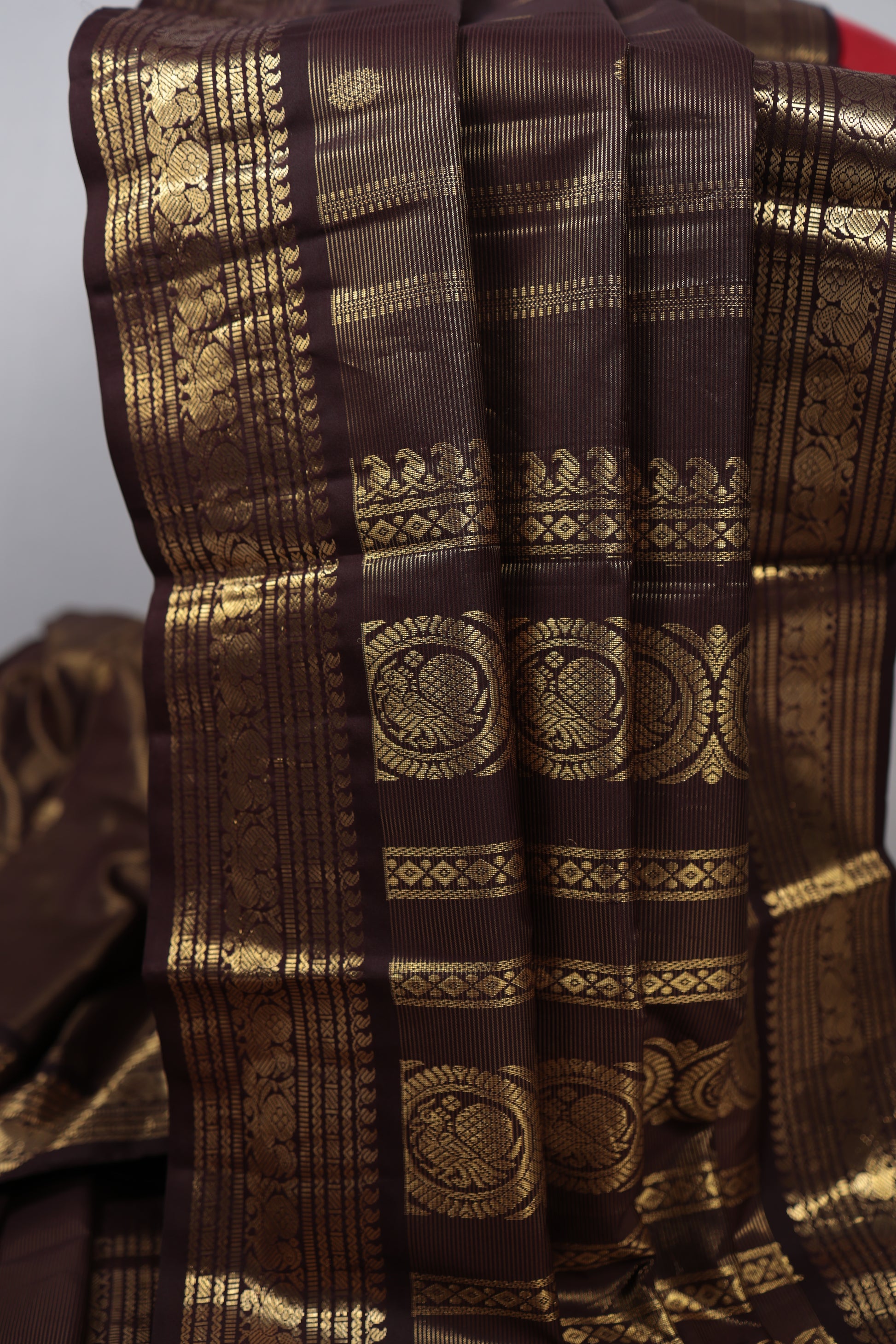Brown fabric with gold intricate patterns