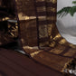 Folded deep brown vairaoosi Kanchipuram silk saree with zari woven border on white fabric, available in the USA
