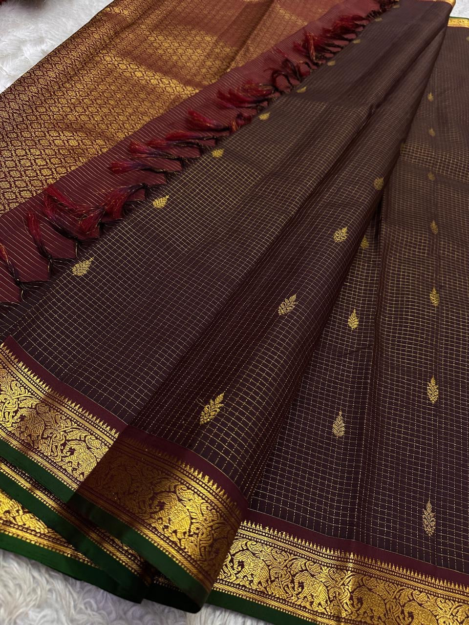 Pure silk Kancheepuram saree in deep coffee brown with emerald green edge