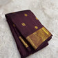 Authentic Kancheepuram silk saree featuring earthy brown silk and luminous antique gold Annapakshi weaving