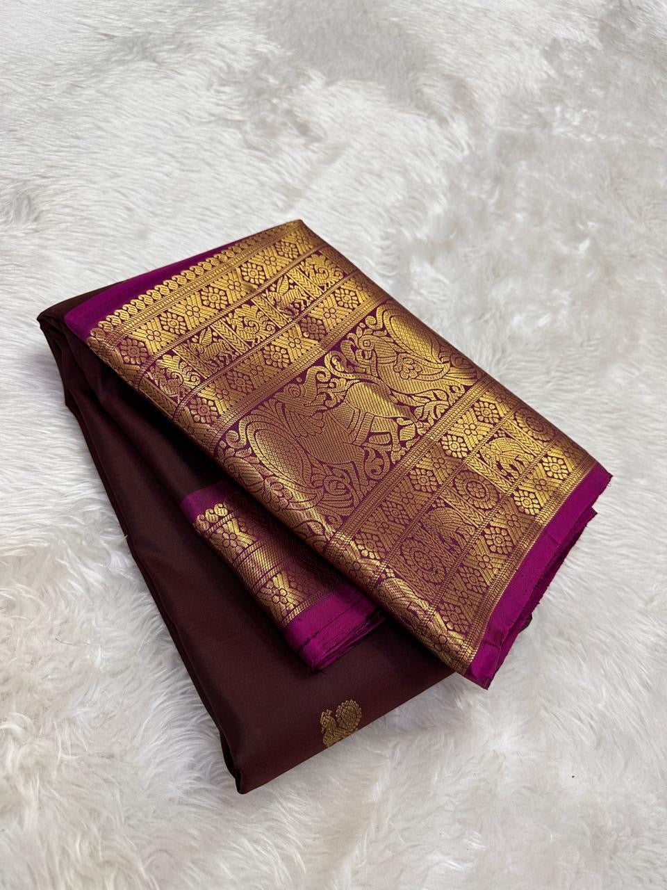 Authentic Kancheepuram silk saree featuring cocoa brown body and Yazhi motif heirloom zari craftsmanship