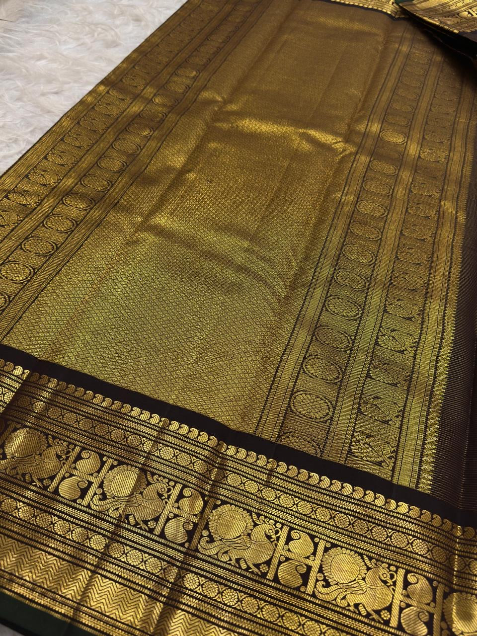 Handwoven Pure Silk Kanchipuram saree with Lightweight Kanchipuram construction and warm gold zari detailing.
