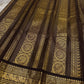Close view of stylized bird motifs woven into Kanchipuram gold zari border