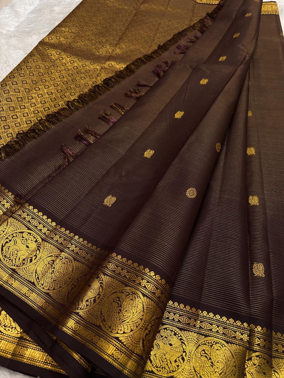 Deep brown handwoven pure silk Kancheepuram saree with Vairaoosi weave Kamalam butta and Mayil antique gold zari border overview