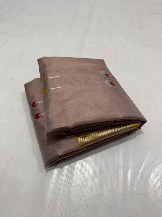 folded brown silk saree with gold border