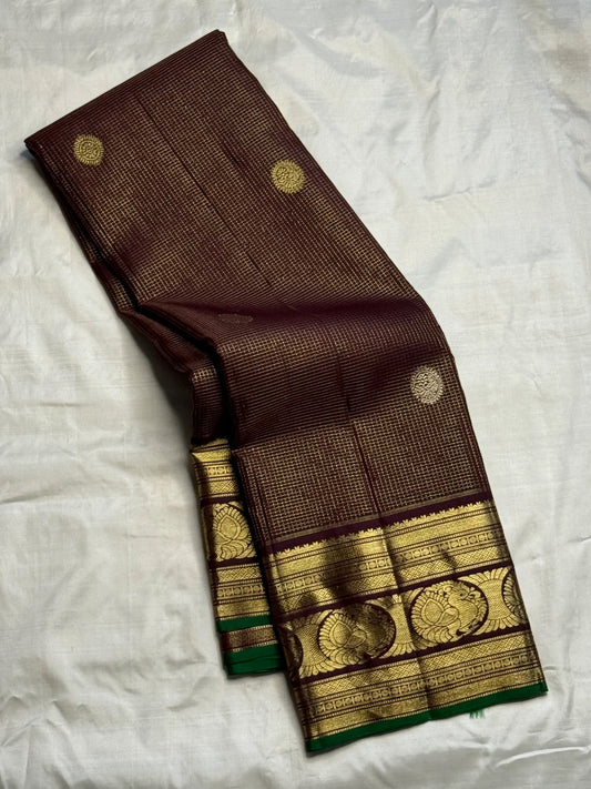 Gold zari peacock-paisley border with green selvedge on brown silk
