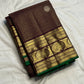 Gold zari peacock-paisley pallu detail on brown Zari Kattam saree