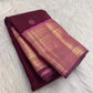 Burgundy Kanjivaram silk saree with petite floral Poo Buttas and pink Pettu