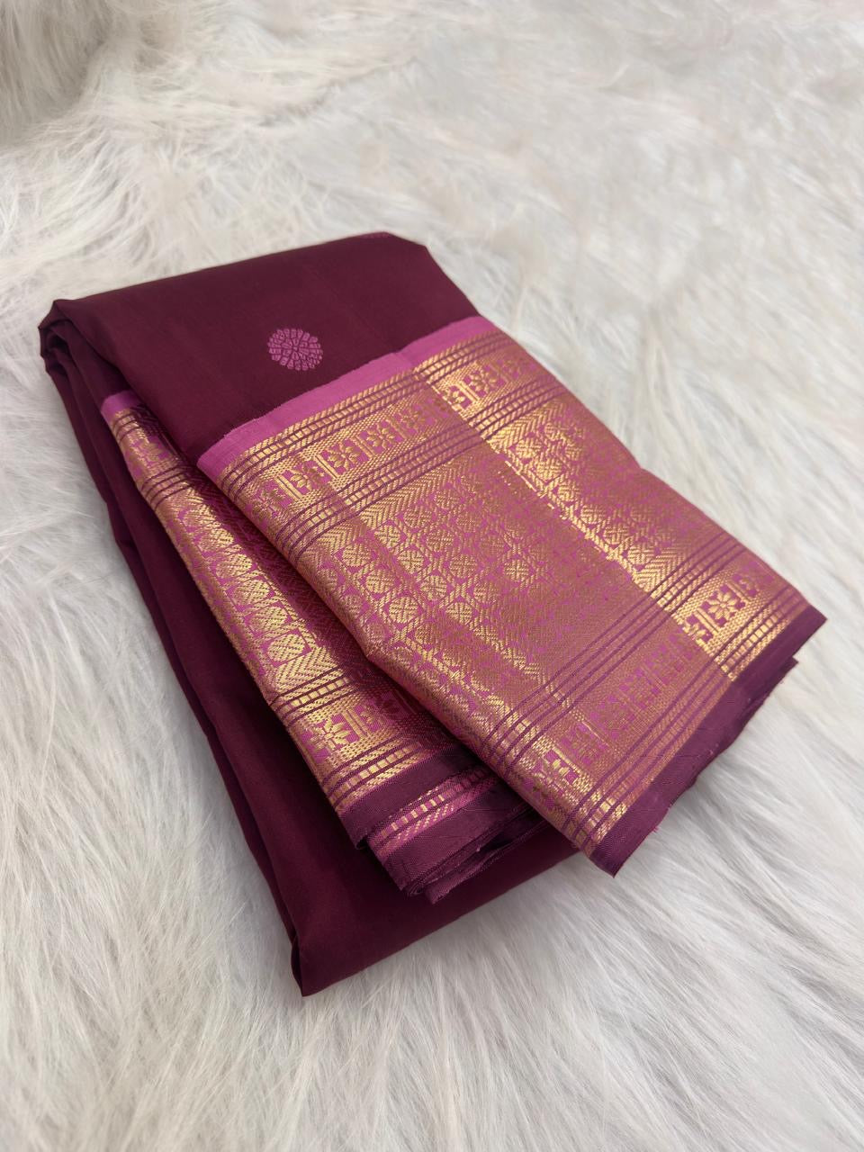 Burgundy Kanjivaram silk saree with petite floral Poo Buttas and pink Pettu