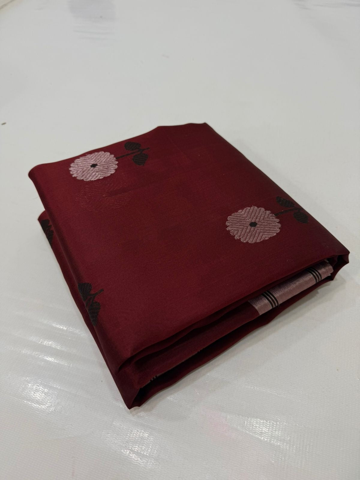 Folded view of Deep Burgundy Pure Silk Chanderi Saree with Black Border