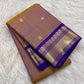 Burnished mustard gold handwoven pure silk Kanchipuram Korvai saree with royal violet zari border, main view