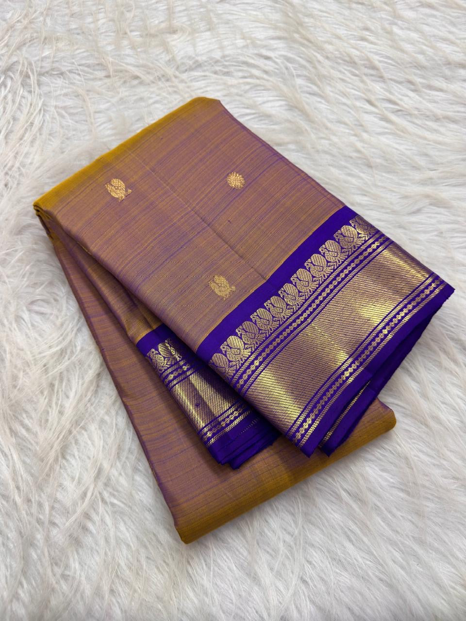 Burnished mustard gold handwoven pure silk Kanchipuram Korvai saree with royal violet zari border, main view