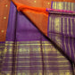 Orange Kanchipuram silk with Mayil Chakram buttas and purple border
