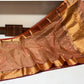 Burnished rust handwoven Chanderi silk with circular gold buttas