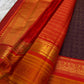 Burnt copper Kanchipuram silk saree with fine horizontal zari stripes across the body